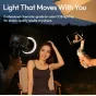 Ulanzi C60 60W bi-color LED video light illuminating a subject outdoors at dusk, used with a smartphone gimbal for professional filming, providing adjustable 2500K-6500K color temperature for high-quality results.