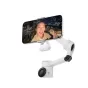 Insta360 Flow 2 Pro gimbal with attached Flow 2 Pro Light LED accessory, providing adjustable lighting for mobile filming and vlogging in a nighttime cityscape.