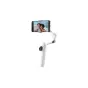 Insta360 Flow 2 white smartphone gimbal with AI tracking in selfie stick mode, capturing a beach selfie on smartphone screen
