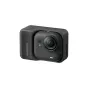 Компактная акционная камера Insta360 GO Ultra Creator Bundle черного цвета в боковом ракурсе с акцентом на детали переднего объектива