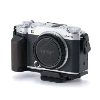 Fujifilm X-M5 with Tilta The Thumb Grip - black hot shoe stabilizer for smoother handheld shots, featuring wooden L-grip handle and ARCA quick release plate for tripod compatibility