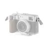 Fujifilm X100VI camera with Tilta top protection plate, silver body, side view with wooden grip for better handling