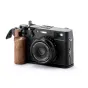 Fujifilm X100VI with Tilta Vintage Camera Cage, black walnut grip, and L-bracket for stable handheld shooting and strap attachment.