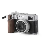 Tilta Vintage Camera Cage for Fujifilm X100VI with walnut wood handgrip and L-bracket, silver finish, side view showcasing ergonomic thumb grip and lens detailsTilta Vintage Camera Cage for Fujifilm X100VI with walnut wood handgrip and L-bracket, silver finish, side view showcasing ergonomic thumb grip and lens details