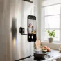 Ulanzi MA50 magnetic phone holder attached to a fridge door, displaying a video call on a smartphone for smart home convenience