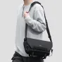 Ulanzi B010 9L water-resistant sling bag with customizable dividers, worn over shoulder in stylish black design