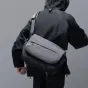 Ulanzi TE88 15L lightweight camera shoulder bag with a 3-point harness system, shown from the back with secure strap attachment for active use