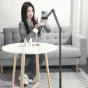 Ulanzi TH07 overhead phone stand in use with adjustable height and dual pivoting arms for versatile smartphone filming, featuring a 360° phone clamp and a sturdy anti-slip base.