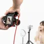 Ulanzi UKA10 cable clamp securing red tethering cable on DSLR camera hot shoe for professional photography setup