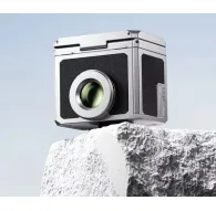 Ulanzi VF01 silver waist-level optical viewfinder with magnetic sunshade for low-angle photography, compact design on textured rock surfaceUlanzi VF01 silver waist-level optical viewfinder with magnetic sunshade for low-angle photography, compact design on textured rock surface