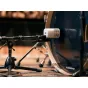 Universal Audio SD-5 dynamic microphone on a stand, angled slightly upward, positioned near a bass drum, ideal for high SPL recording.