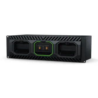 Blackmagic Design Media Dock Ultra front view featuring a sleek black design, three slots for Blackmagic Media Modules, and illuminated status indicators, including a highlighted green middle slot.