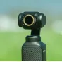 Набор нейтрально-серых фильтров Vaxis Movmax для DJI Pocket 3 с магнитным ND8 фильтром, подчеркивающим круглый дизайн и быструю смену для кинематографической съемки на открытом воздухе.