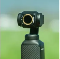 Vaxis Movmax ND filter set for DJI Pocket 3 with magnetic ND8 filter attached, showcasing its circular design and quick-swap mounting for cinematic outdoor videography.Vaxis Movmax ND filter set for DJI Pocket 3 with magnetic ND8 filter attached, showcasing its circular design and quick-swap mounting for cinematic outdoor videography.