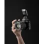 Nikon DSLR with Viltrox Vintage Z2-N compact flash mounted on hot shoe, powered on for studio lighting demo