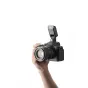 Sony Alpha camera with Viltrox Vintage Z2-S compact flash mounted on top for portable studio lighting