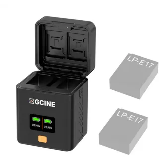 ZGCINE Canon LP-E17 bateriju uzlādes korpuss ar atvērtu vāku, diviem bateriju slotiem, OLED ekrānu, kas rāda sprieguma līmeņus, un atmiņas kartīšu nodalījumiem.