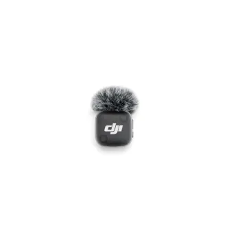 DJI Mic Mini 2 wireless microphone transmitter with gray furry windscreen, top view