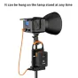 ZGCINE VM-C2 dual V-Mount battery charger with 100W USB-C PD charging, mounted on a lamp stand for professional video setup