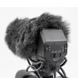 Azden SWS-15 wireless microphone transmitter with faux fur windshield cover, front view featuring adjustable controls for power and gain.