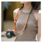 FALCAM Maglink Quick Magnetic Buckle Shoulder Strap Lite V2 in green with magnetic release, worn crossbody and around neck with a camera