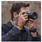 Falcam Maglink Quick Magnetic Buckle Wrist Strap V2 in gray, securely attached to a DSLR camera and worn as a stylish bracelet on the wrist.