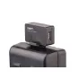 Адаптер SWIT S-7111 D-tap к USB, подключенный к аккумулятору камеры, с USB портом и вентиляционной секцией, четко виден логотип.