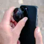 Moment Fisheye 8mm Mobile Lens II attached to smartphone for ultra-wide 200° immersive photography and POV videography