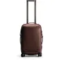 Peak Design Roller Pro Carry-On suitcase with extended SlimDrive carbon fiber handle, rear view showcasing sturdy zipper closure, external pocket, and Cord Hook storage system