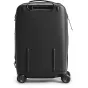Black Peak Design Roller Pro Carry-On luggage viewed from the rear, featuring retractable wheels and a SlimDrive trolley handle for easy travel.