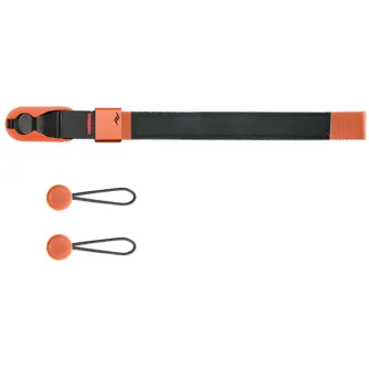 Peak Design Cuff wrist strap with adjustable aluminum adjuster, orange accent webbing, and V4 Anchor connectors for secure camera drop protection