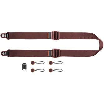 Peak Design Slide Lite camera strap set featuring dual adjustable buckles, Anchor Link connectors, and a microfiber pouch for secure carrying of mirrorless and DSLR cameras.