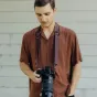 Peak Design Slide Lite camera strap in use with Fujifilm mirrorless camera, showcasing Anchor Link connector system and versatile sling design