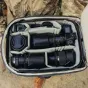 Peak Design Travel Backpack 45L ocean interior view with camera lenses and accessories organized in padded compartments