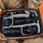 Peak Design Travel Backpack 45L Eclipse with organized camera gear inside, featuring padded compartments for lenses, camera body, and accessories.