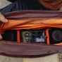 Peak Design Everyday Tote V2 15L bag with Sony mirrorless camera securely stored in padded compartment, showcasing interior organization with FlexFold dividers and magnetic closure