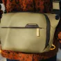 Peak Design Everyday Sling V2 3L kelp green bag front view featuring a black zipper and logo detail
