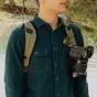 Peak Design Capture V3 Camera Clip with DSLR camera securely attached for quick access and travel convenience