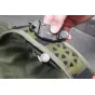 Peak Design Capture Clip V3 close-up with quick-release mechanism and secure grip on camouflage strap