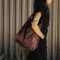 Peak Design Packable Tote in eclipse brown, compact and stylish with a single padded shoulder strap for easy carrying.