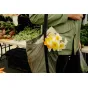 Peak Design Packable Tote in eclipse with zip closure and padded shoulder strap, featuring a bouquet of flowers hanging from the handle.