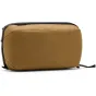 Peak Design Wash Pouch toiletry bag in coyote color, durable travel organizer with UltraZip closure.