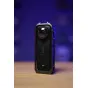 Insta360 X5 8K 360-degree action camera front view with active display showing a vibrant city photo of two people posing.