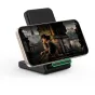 Tech-Protect QI15W wireless charger in black with LED indicator, holding smartphone vertically for fast Qi charging