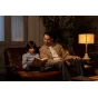 Cozy reading scene with a man and a child enjoying a book in warm lighting, inspired by the Tamron 17-70mm F2.8 Di III-A VC RXD lens for Canon RF APS-C.