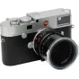 Leica camera with Summilux-M 1.4/50 ASPH lens, classic silver and black design, detailed aperture and focus markings, side view