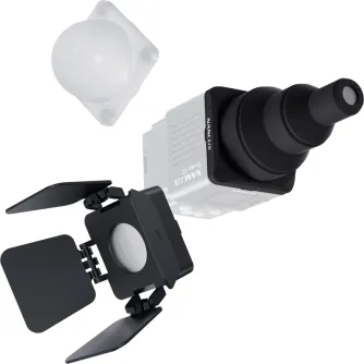 NANLUX Evoke 5C Lighting Modifier Kit featuring a white spherical diffuser, a silver rectangular modifier with a black lens attachment, and a black square diffuser with adjustable flaps for studio lighting control.