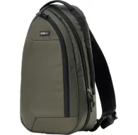 Green Think Tank TurnStyle 11L sling bag made from eco-friendly materials, featuring a padded tablet pocket and breathable mesh back panel for photographers.Green Think Tank TurnStyle 11L sling bag made from eco-friendly materials, featuring a padded tablet pocket and breathable mesh back panel for photographers.