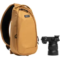 Think Tank TurnStyle 5L Golden Hour sling bag featuring a black mesh back panel, dual zippered compartments, a secure front pocket, and a camera clip rail, with a Sony Alpha DSLR and 24-70mm lens beside it.Think Tank TurnStyle 5L Golden Hour sling bag featuring a black mesh back panel, dual zippered compartments, a secure front pocket, and a camera clip rail, with a Sony Alpha DSLR and 24-70mm lens beside it.