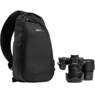 Black Think Tank TurnStyle 8L sling bag with Nikon DSLR camera and lens attached in front compartment.Black Think Tank TurnStyle 8L sling bag with Nikon DSLR camera and lens attached in front compartment.